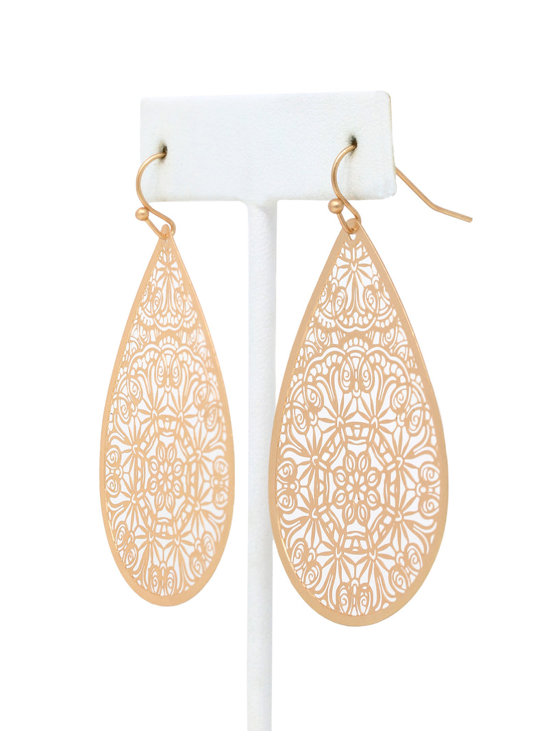 Gold teardrop earrings with intricate patterns on a white background.