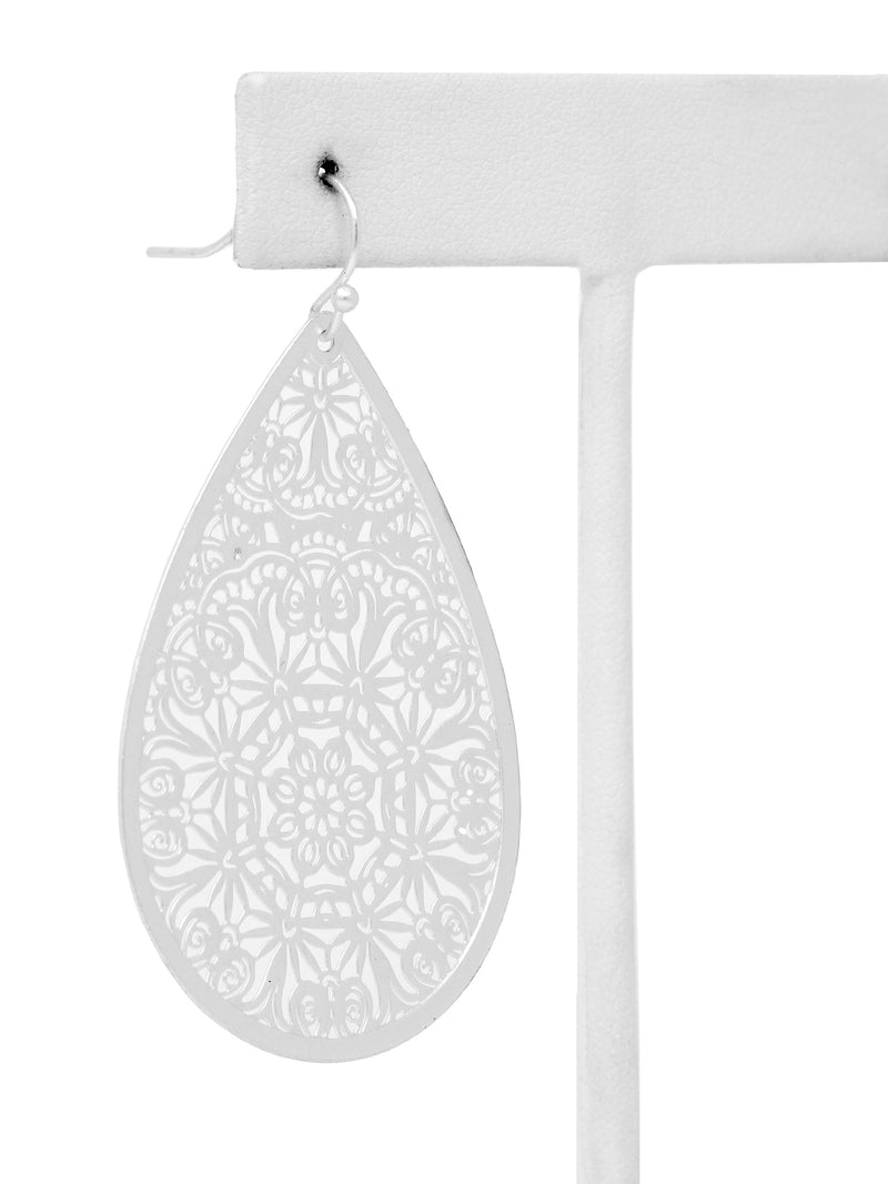 White teardrop-shaped earrings with intricate patterns on a white background
