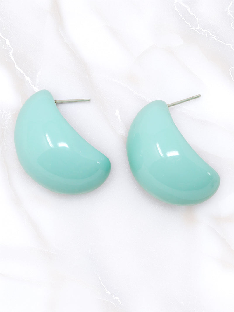 A pair of bold, puffy mint green resin hoop earrings.