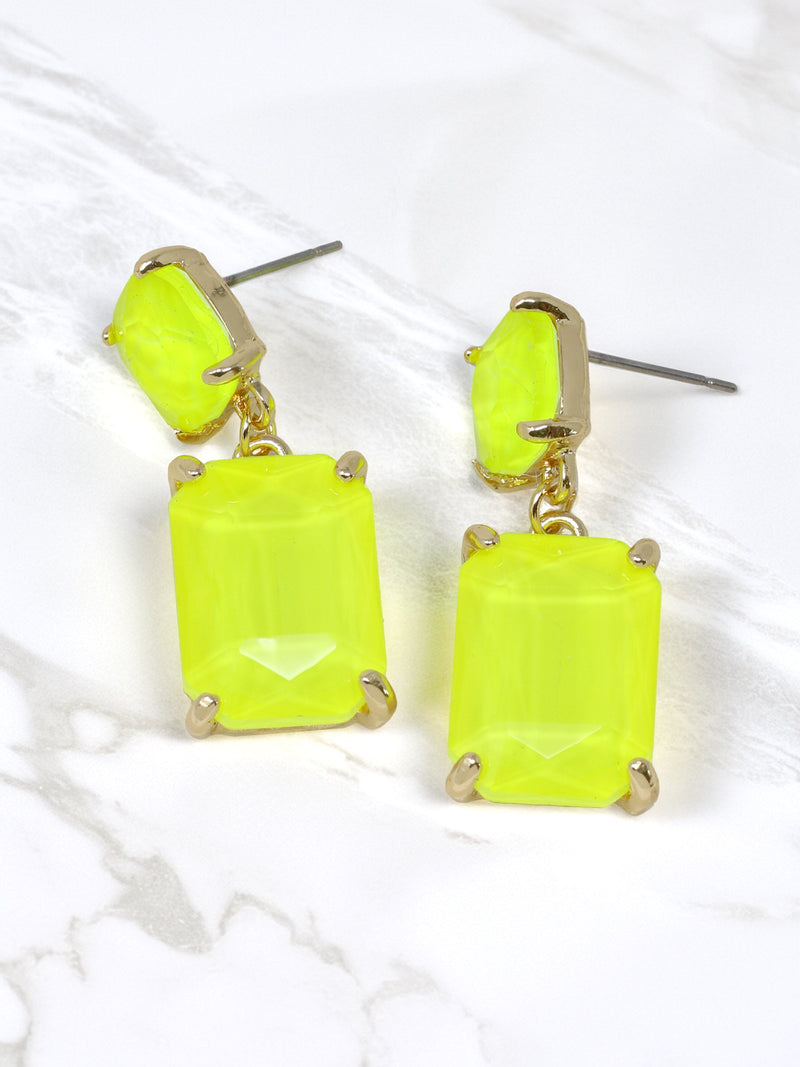 Neon yellow rectangle-shaped glass stone drop earrings with faceted detailing, set in gold-tone metal, displayed on a white earring stand.