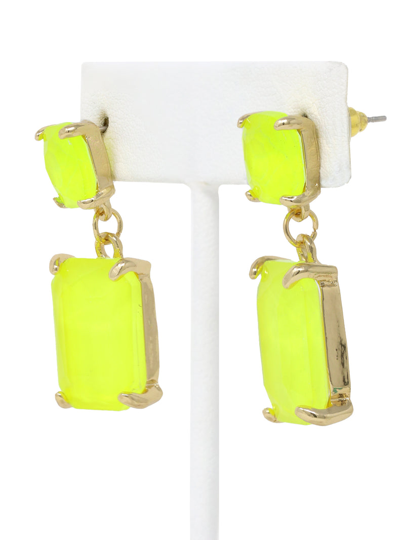 Neon yellow rectangle-shaped glass stone drop earrings with faceted detailing, set in gold-tone metal, displayed on a white earring stand.
