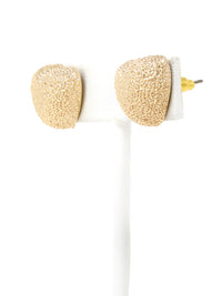 A pair of gold-tone textured puffy heart stud earrings with a delicate, intricate surface pattern.