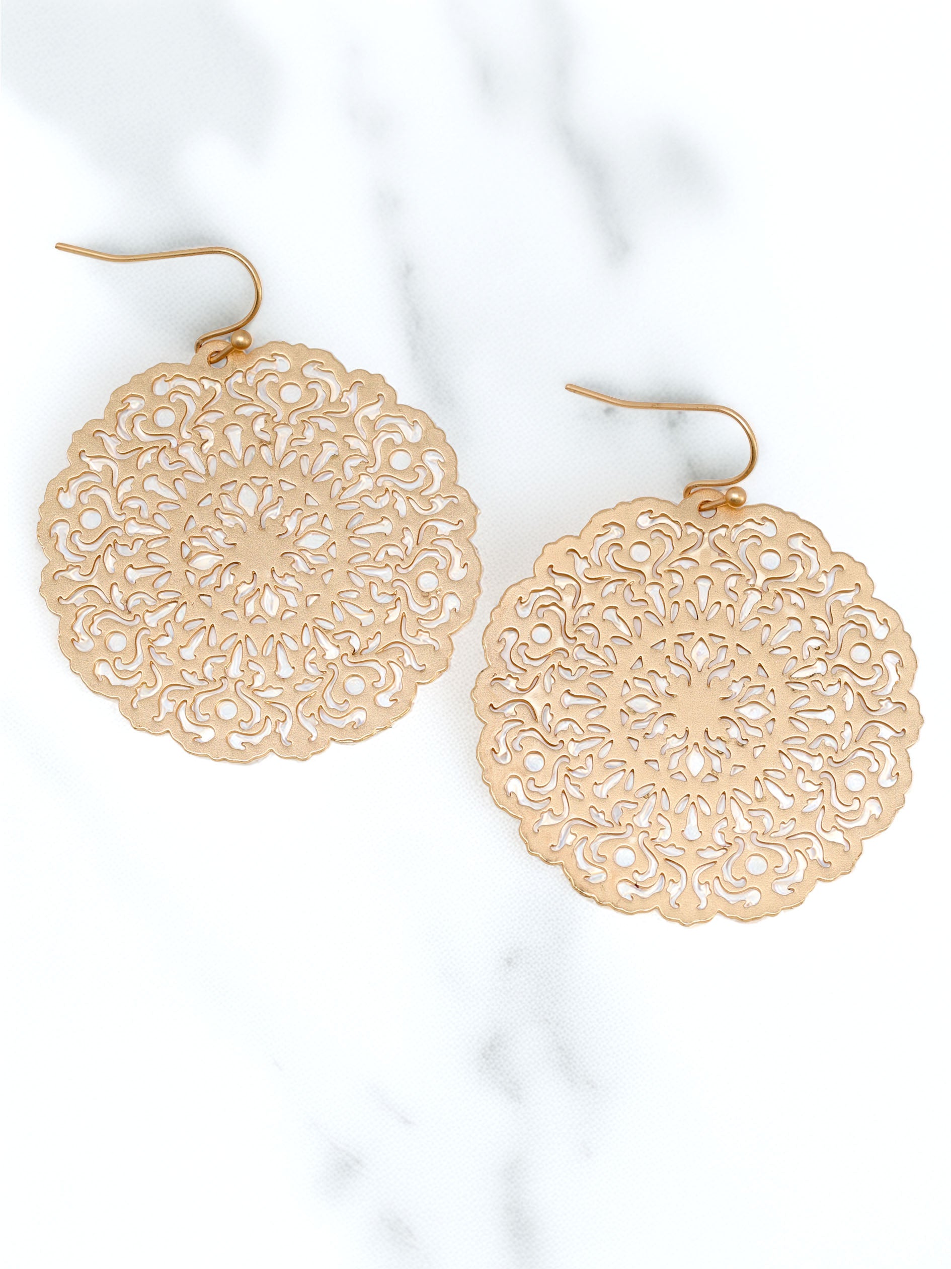 Lightweight round filigree metal drop and dangle earrings featuring an intricate openwork circular design in a gold-tone finish.