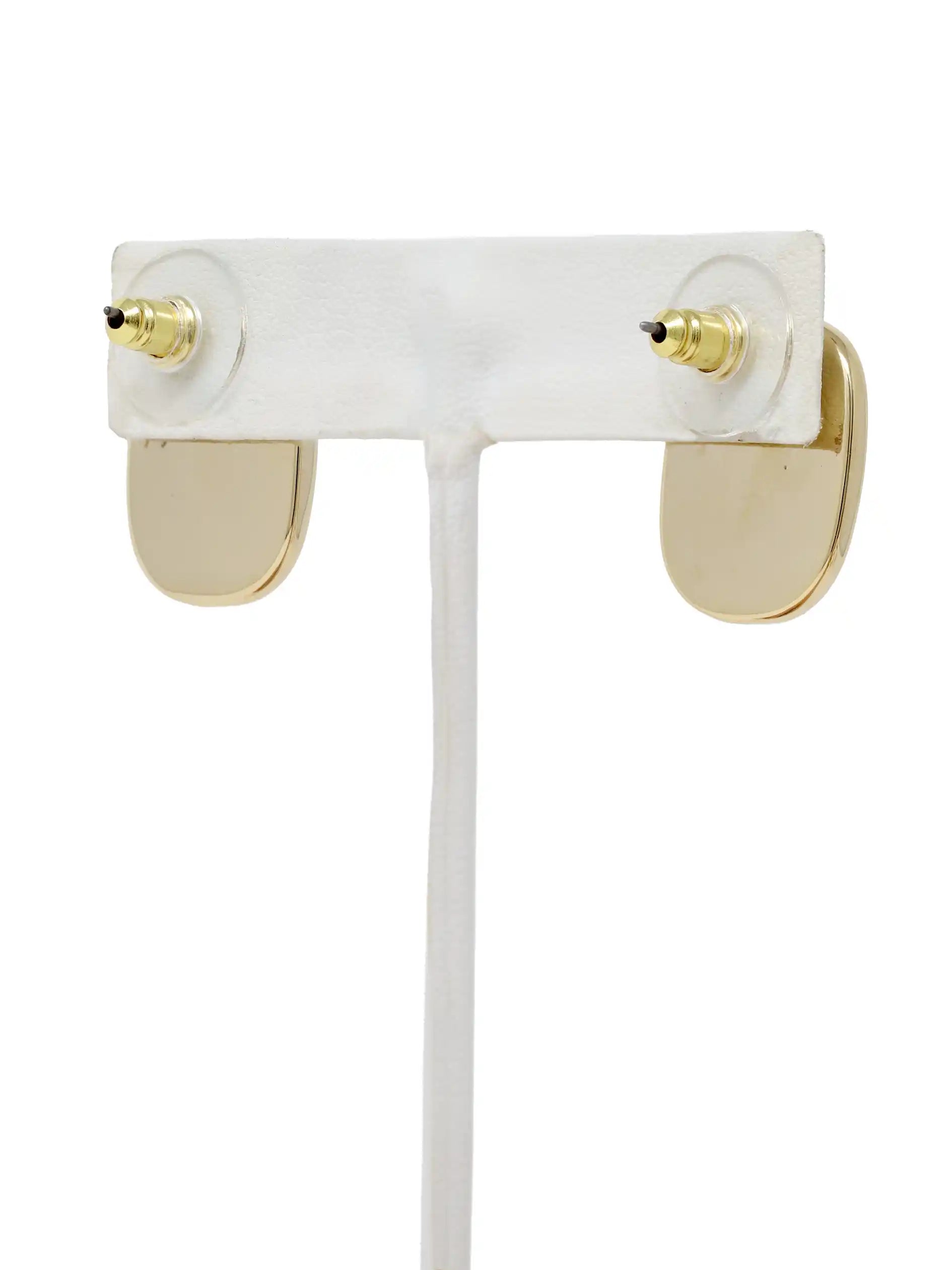 Pair of gold-framed sunglasses on a white stand with a white background