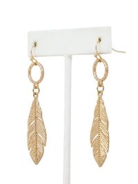 Gold leaf drop dangle earrings with textured circular links and detailed cutout leaf pendants.