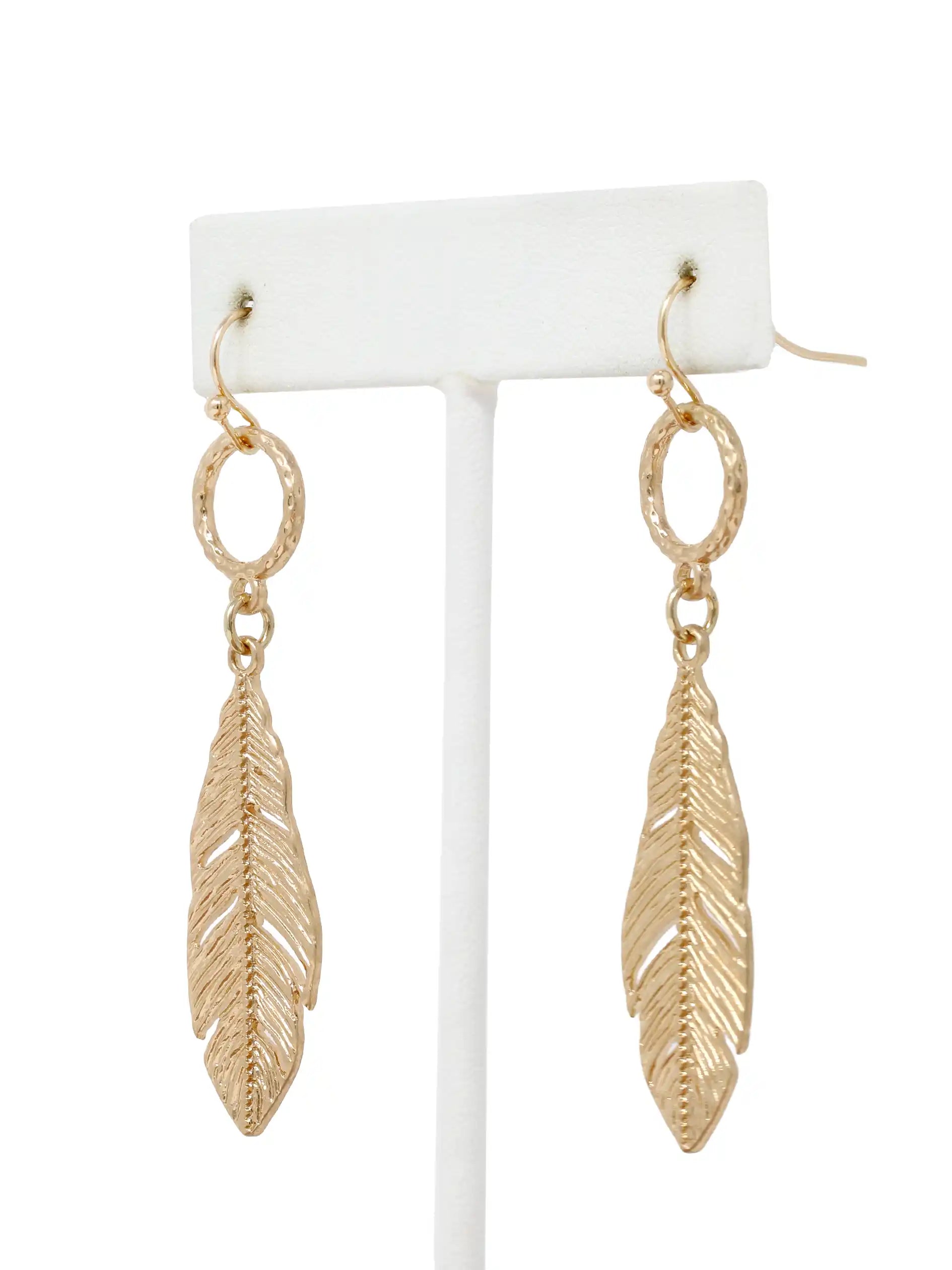 Gold leaf drop dangle earrings with textured circular links and detailed cutout leaf pendants.