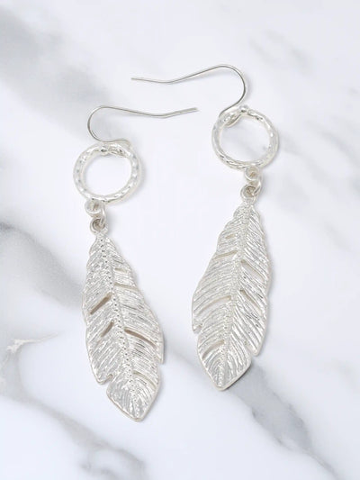 Silver leaf drop dangle earrings with textured circular links and detailed cutout leaf pendants.