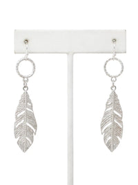 Silver leaf drop dangle earrings with textured circular links and detailed cutout leaf pendants.