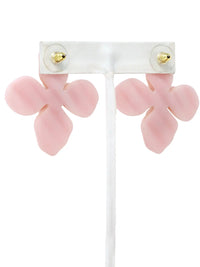 Pink flower-shaped earrings on a white background