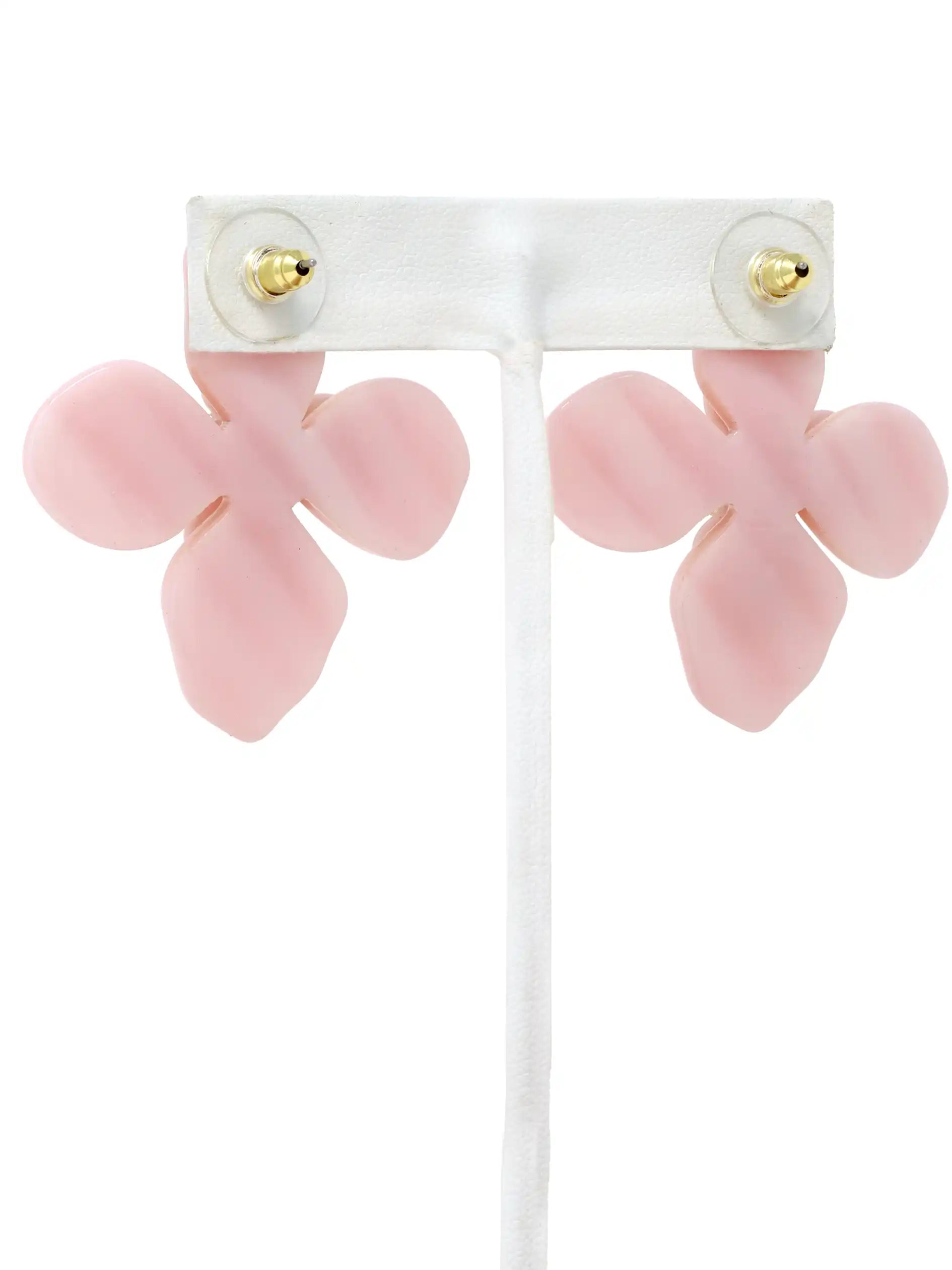 Pink flower-shaped earrings on a white background