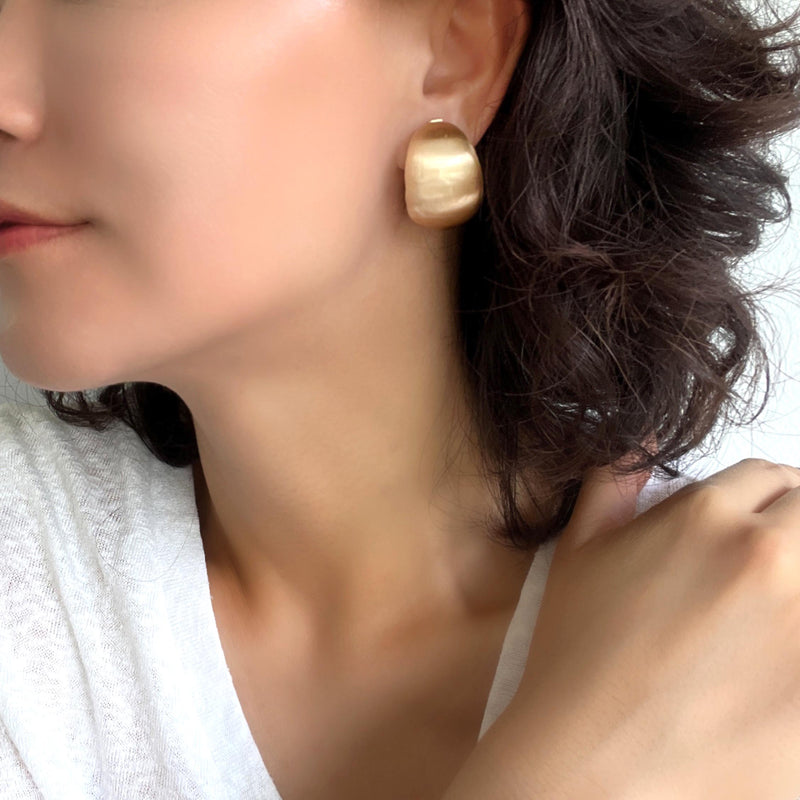 Gold bold statement earrings with hollow bold design.
