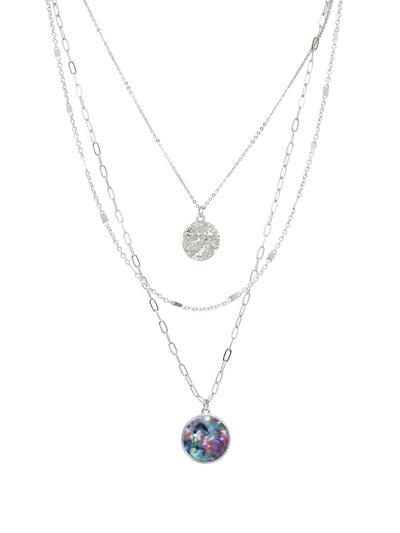 Layered silver necklaces with colorful abalone pendant on a white background.