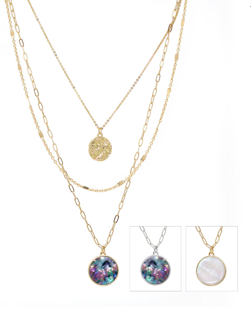 Triple-layered gold necklace featuring a dangling charm made of natural Mother of Pearl or abalone.