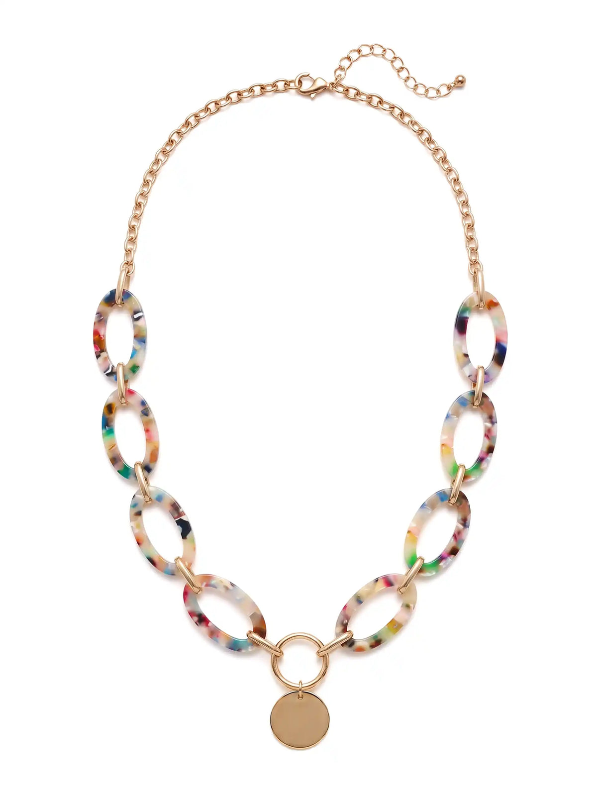 A statement necklace against a white background, featuring large, oval multi colored resin links connected by gold-toned metal and a central, polished gold-toned circular pendant.