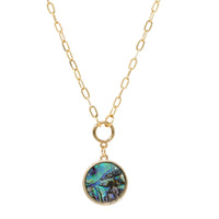 A short gold necklace featuring a natural abalone charm delicately dangled from a sleek and modern paperclip chain.