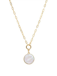 A close-up product image of the modern shell short necklace, displaying a round, iridescent mother of pearl shell pendant hanging from a gold-plated paperclip chain.