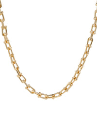A bold gold link chain necklace with geometric links and polished bead connectors.