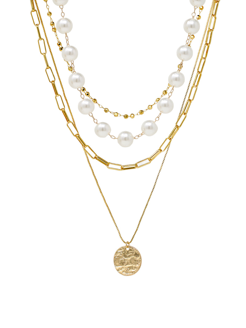 4-layer necklace featuring paperclip chain links, white pearls, gold bead accents, and a hammered coin pendant.