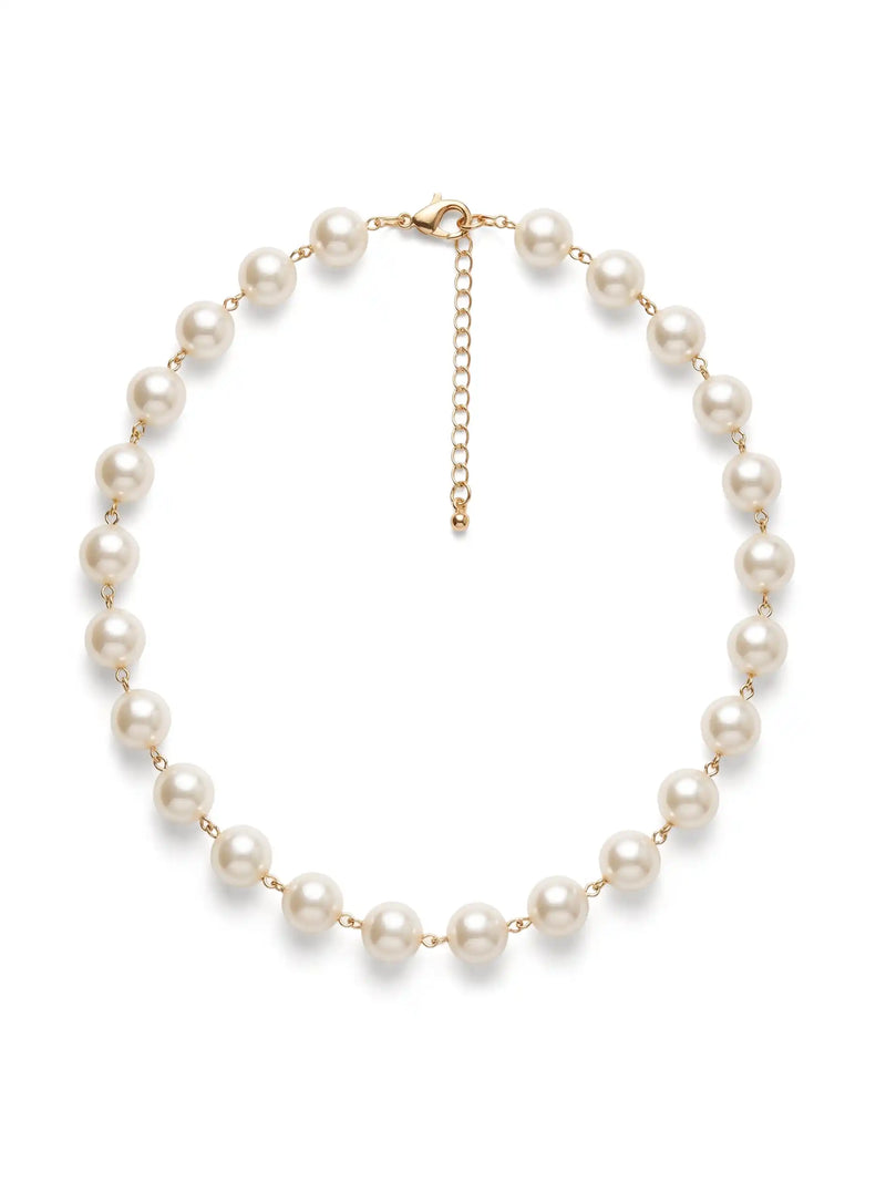 A 17-inch short necklace featuring smooth, round faux pearls evenly spaced and connected by delicate gold-tone chain links, complete with a matching gold-tone adjustable extender chain and lobster clasp, set against a solid white background.