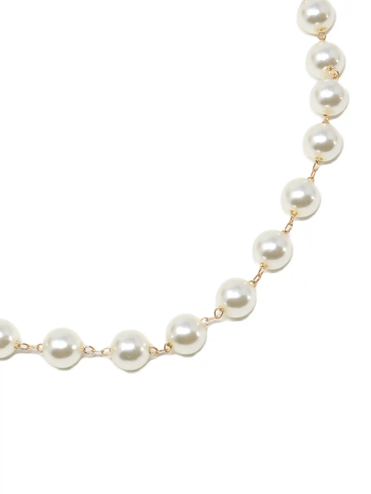 A delicate necklace featuring a strand of round, creamy white faux pearls. The pearls are strung on a fine gold-colored chain, with a matching clasp and adjustable extender. This elegant piece is suitable for various occasions.