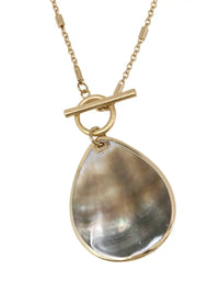 Gold necklace with a large teardrop-shaped pendant on a white background