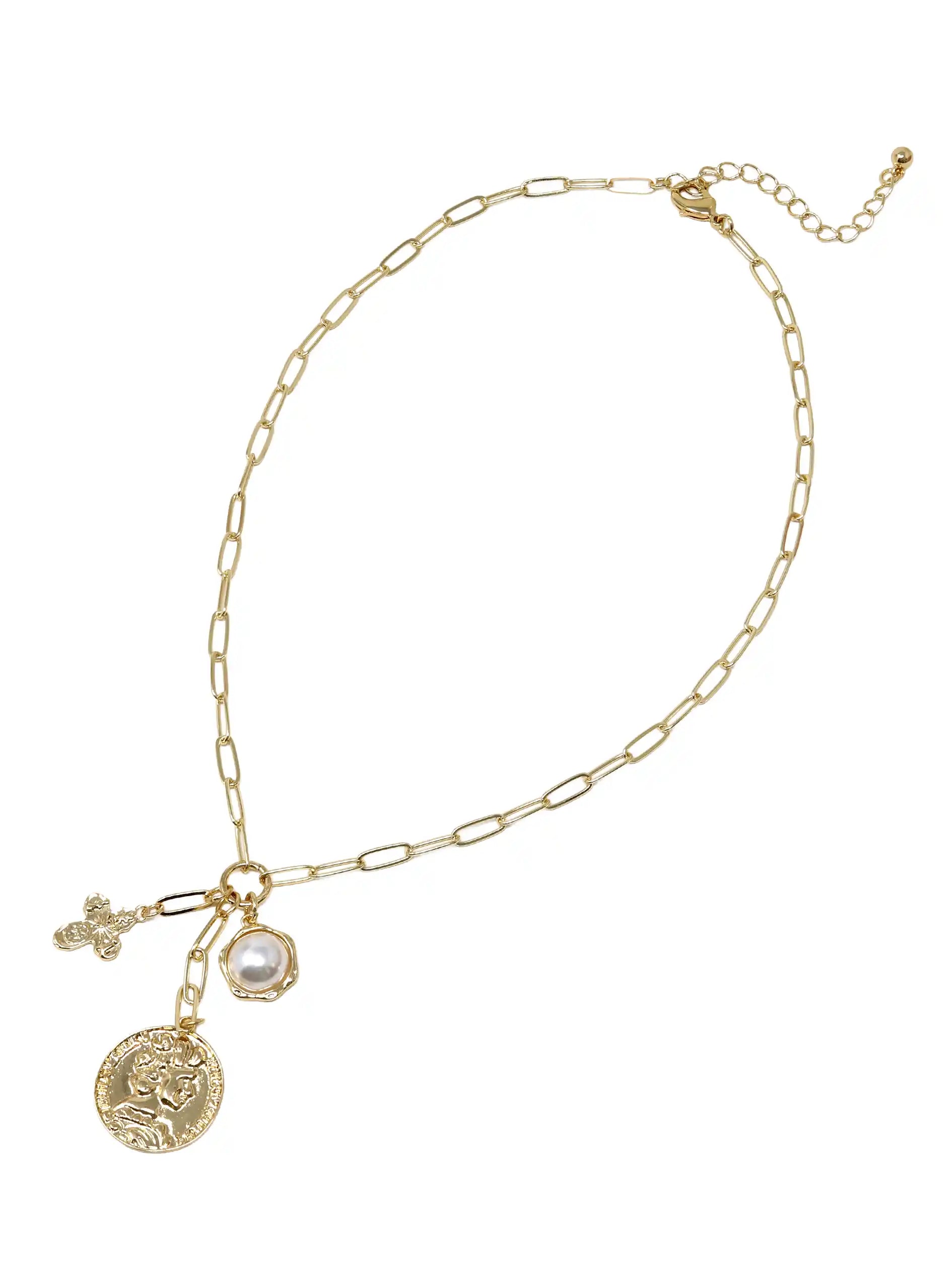 Gold chain necklace with charms on a white background