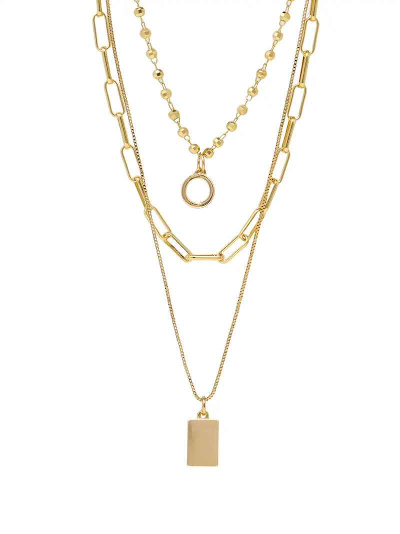 A layered gold necklace set featuring three distinct chains: a thick paperclip chain, a delicate beaded chain with a circular ring pendant, and a fine chain with a rectangular plate pendant, displayed on a clean white background.