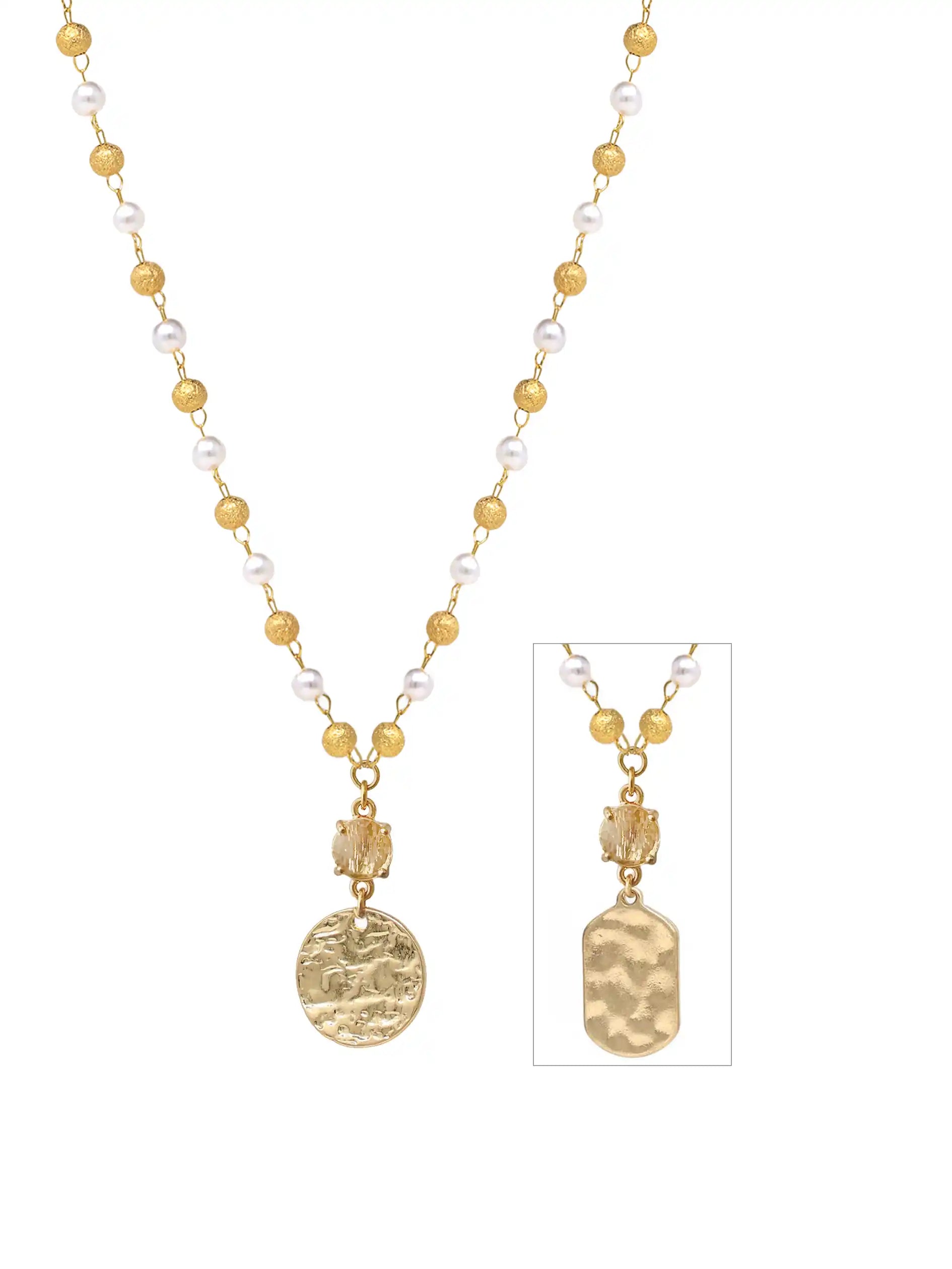 A gold and white beaded necklace with a textured gold pendant, shown on a white background with a smaller inset detail view of the pendant.