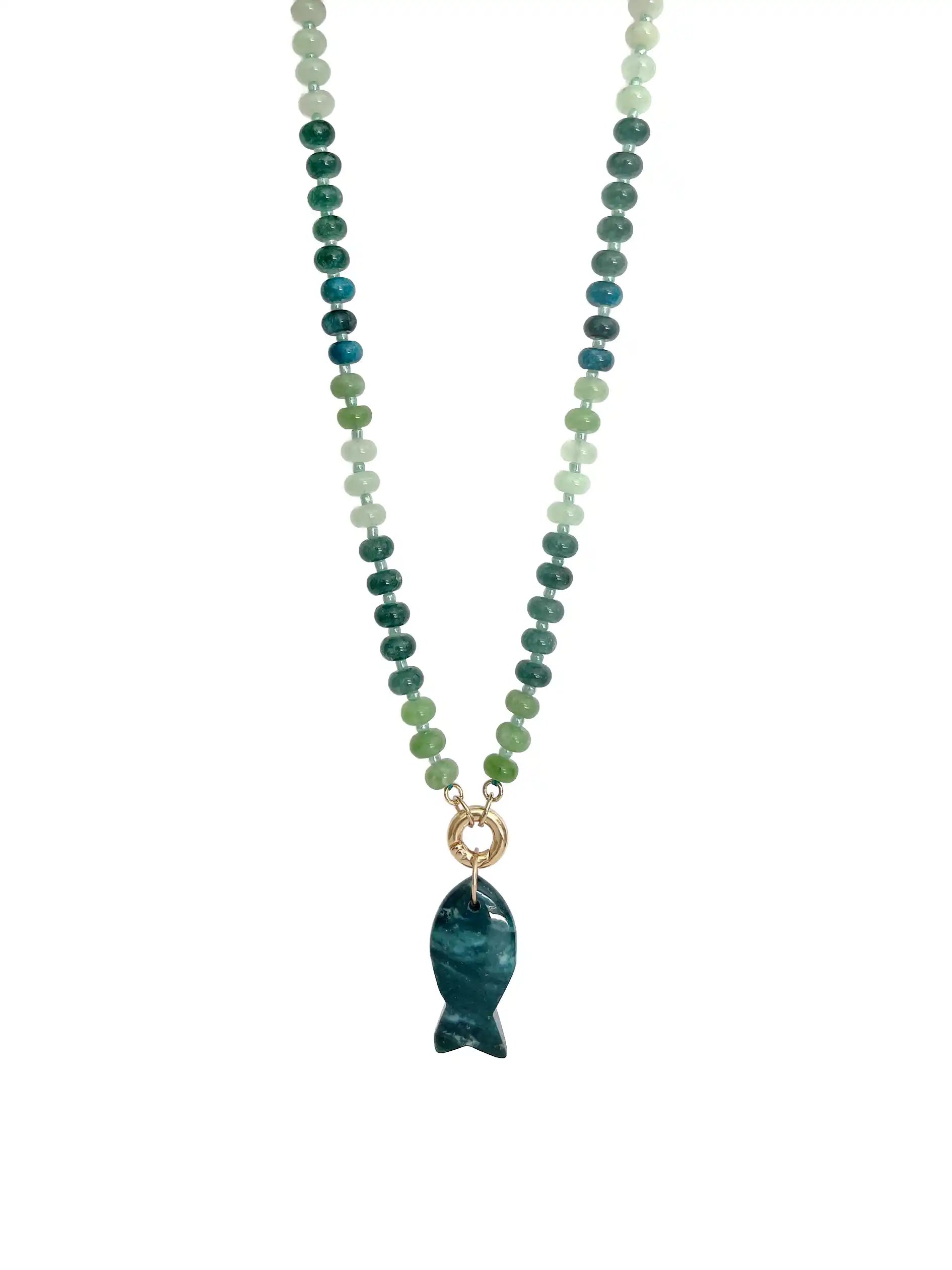 A beaded necklace featuring green and blue gradient round beads with a polished dark moss green agate fish-shaped pendant, suspended from a gold ring on a white background.