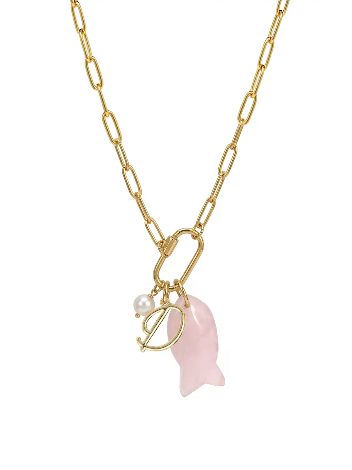 A gold paperclip chain necklace featuring a front-facing carabiner clasp that holds three distinct charms: a small round pearl, a gold script initial D, and a carved pink rose quartz fish pendant.