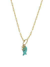 A gold paperclip chain necklace featuring a front-facing carabiner clasp that holds three distinct charms: a small round pearl, a gold script initial B, and a carved turquoise blue fish pendant.
