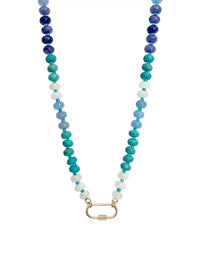 A semi-precious stone beaded necklace featuring a gradient of blue, teal, and white round beads, finished with a gold-toned carabiner clasp, shown against a plain white background.