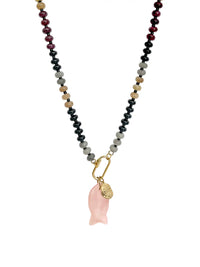A beaded necklace featuring a strand of beads in black, gray, tan, and deep red, with a gold carabiner holding a pink rose quartz fish-shaped pendant and a small gold textured coin, shown on a plain white background.