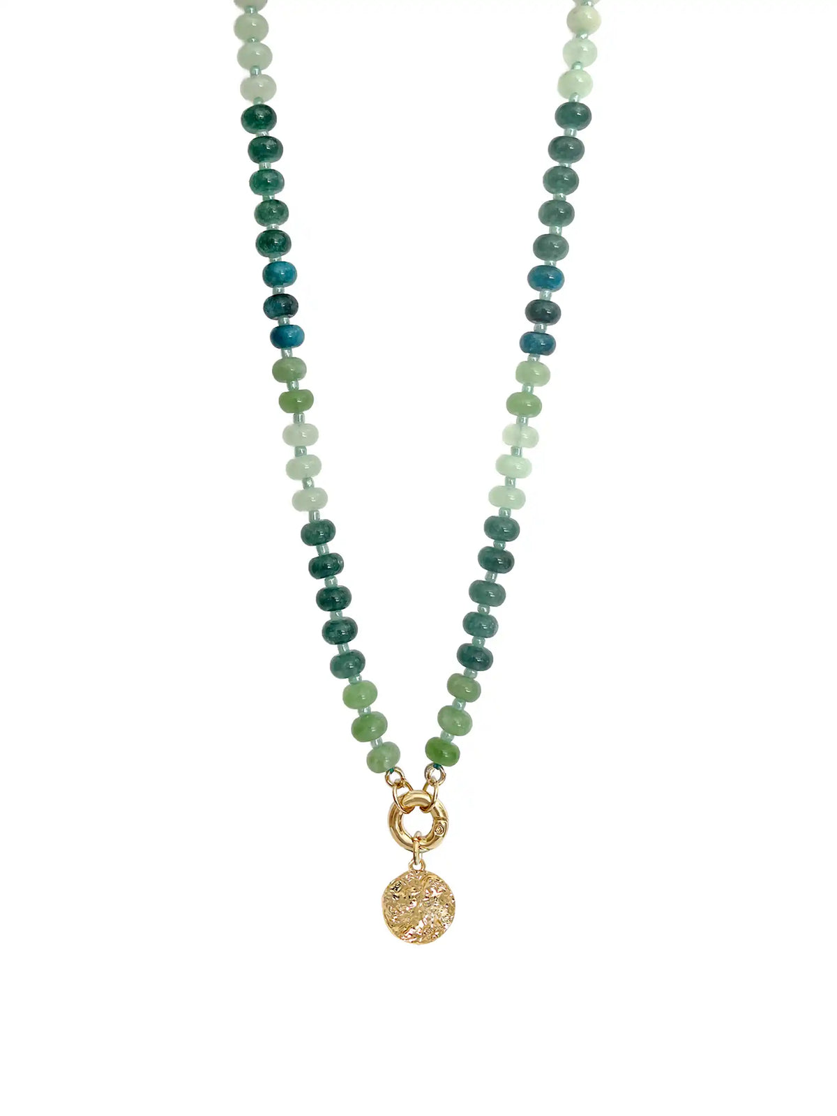 Green beaded statement necklace with mixed green beads, gold-tone clasp, and textured round coin pendant on a white background.