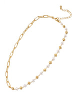 A blend of modern simplicity and timeless elegance in a paperclip chain and pearl statement necklace.