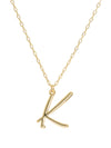Script initial letter K charm necklace dangled in a gold-filled paperclip chain.