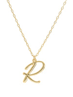 Script initial letter R charm necklace dangled in a gold-filled paperclip chain.