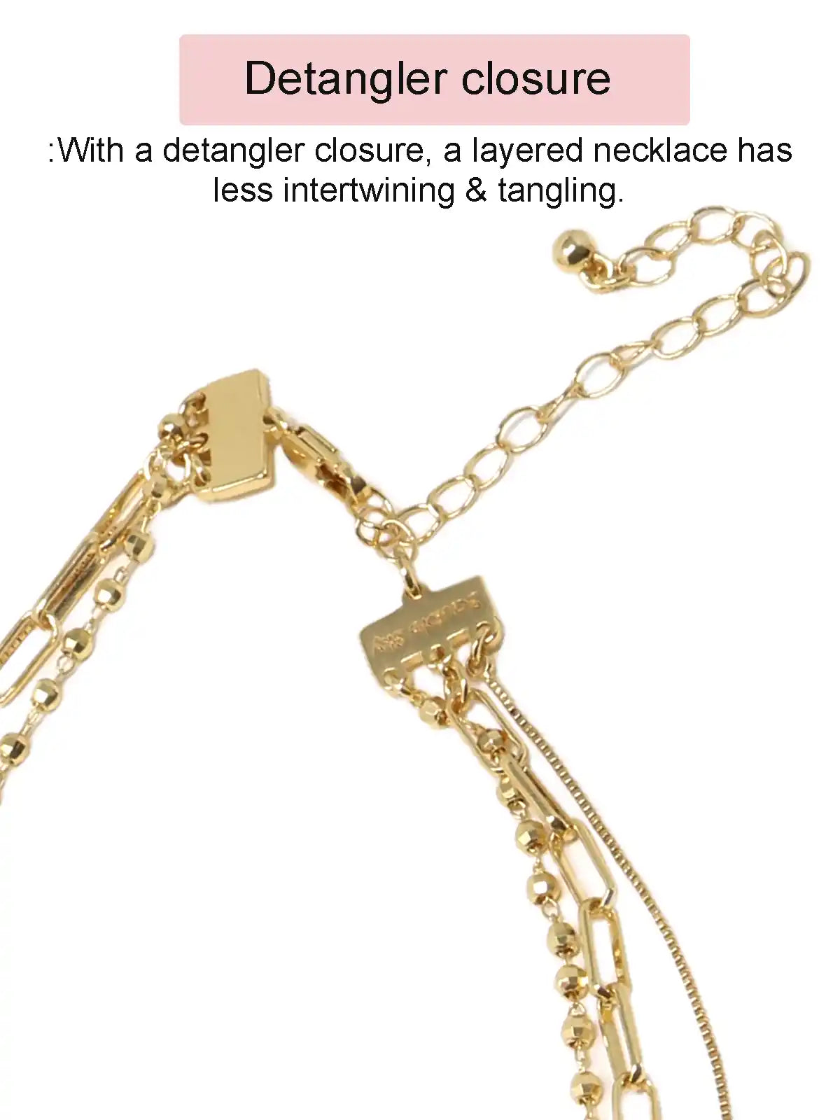 Gold-tone layered chain necklace with a rectangular clasp closure and extender chain, shown on a white background with explanatory text about detangler closure.