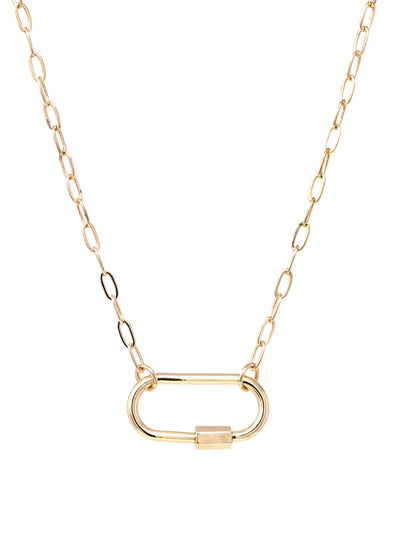 A gold chain necklace featuring a large, minimalist oval carabiner pendant with a small rectangular clasp, displayed on a clean white background.