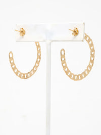 Gold chain-link hoop earrings displayed on a white T-bar jewelry stand against a plain white background.