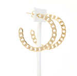 A pair of cuban chain textured hoop earrings made of gold filled.