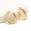 A pair of bold simple hoop huggie earrings made of gold filled.