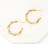 bamboo-inspired hoop earrings in gold.