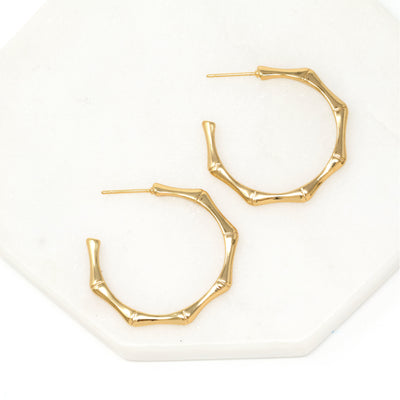 bamboo-inspired hoop earrings in gold.