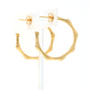 bamboo-inspired hoop earrings in gold.