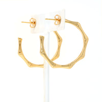 bamboo-inspired hoop earrings in gold.