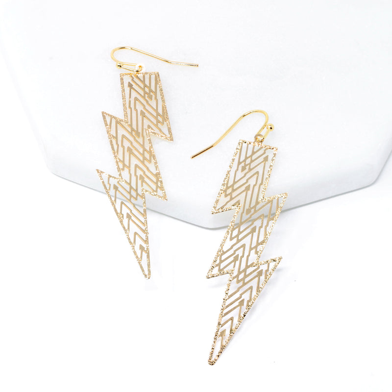 A pair of lightning bolt inspired modern filigree earrings in gold.