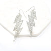 A pair of lightning bolt inspired modern filigree earrings in silver.