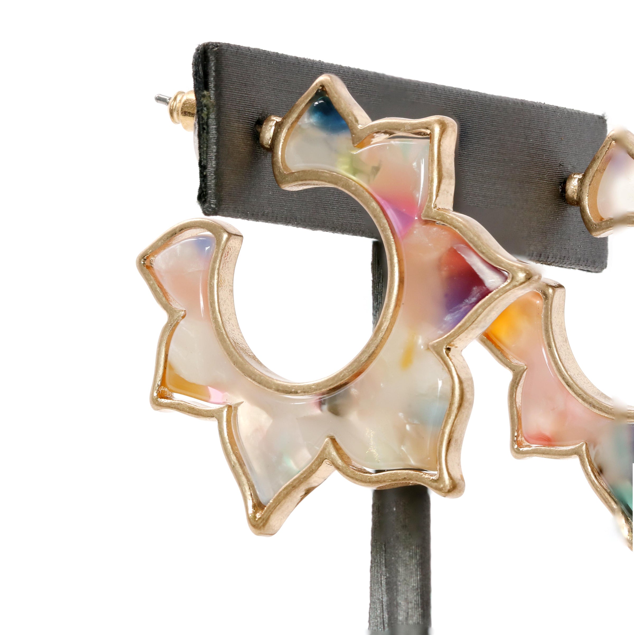 A pair of flower-shaped hoop earrings made of multicolored resin with a gold-tone outline.