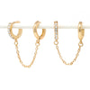 Paved modern loop earplug earrings in gold connected with chains.